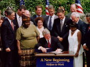 President Bill Clinton signing welfare reform legislation.