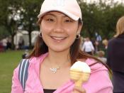 A girl eating an ice cream cone at the Fringe Sunday event.