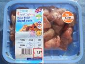 A pack of pork from Tesco is labelled with a sticker that says 