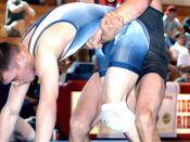 March 12, 2004 Staff Sgt. Keith Sieracki lifts Navy's Jason Nichols during 5-1 victory in the 74-kilogram Greco-Roman division of the 2004 Armed Forces Wrestling Championships March 6 at Metairie, La.