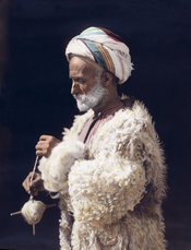 Ramallah man spinning wool. Hand colored photographic print.
