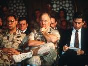Paul Wolfowitz, under secretary of defense for policy, right, takes notes while Gen. Colin Powell, chairman, Joint Chiefs of Staff, and Gen. Norman Schwarzkopf, Jr., commander-in-chief, U.S. Central Command, listen to Secretary of Defense Dick Cheney answ