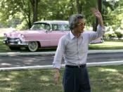 English: Japan's Prime Minister Junichiro Koizumi stands before a classic pink Cadillac and waves to reporters as he wears a pair of Elvis Presley style sunglasses during his tour Friday, June 30, 2006 of Presley's mansion, Graceland, with President Georg