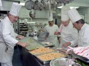 English: White House chefs, directed by Executive Chef Henry Haller, prepare for a state dinner honoring Australian Prime Minister Malcolm Fraser. The chefs are working in the White House kitchen; the dinner occured in 1981, during the administration of R