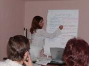 English: Economic development training session in a with the member of a community organisation.