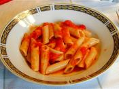 Penne pasta served with tomato sauce