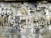 Prince Siddharta Gautama shaves the hair off his head as the sign to decline his status as ksatriya (warrior class) and become sn ascetic hermit, his servants holds his sword, crown, and princely jewelry while his horse Kanthaka stood on right. Bas-relief