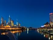 A view of the Yarra River at twilight, with Melbourne's central business district on the left and Southbank on the right