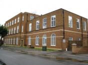 English: Newmarket: Telephone exchange and postal delivery office This 1950s building in The Avenue dates from the time when the General Post Office was responsible for both postal and telecommunications services, and built this structure to house its req