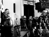 English: Gamal Abdel Nasser takes presidential oath for his third term as president, behind him vice-president Sadat.