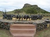 Memorial erected at the site commemorating the fallen Zulu impi at Isandlwana Hill, which is visible in the background