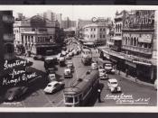 Trams and trolley buses pass through Kings Cross intersection in the 1950s