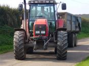 English: Massey Ferguson 8290 Tractor towing a grain trailer