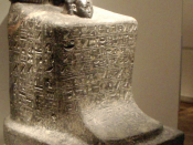 A block statue of Senemut, tutor of Hatshepsut's daughter, whose head appears below his in this sculpture.