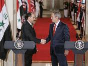 President George W. Bush shakes hands with Iraqi Prime Minister Nouri al-Maliki at the conclusion of their joint press availability in the East Room of the White House Tuesday, July 25, 2006.