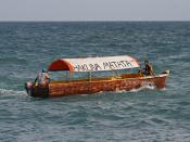 English: A motorboat with an Outboard motor in Zanzibar, Tanzania. The boat bears the popular swahili phrase Hakuna matata