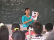 Student teacher in China teaching children English.