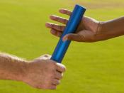 Hands Passing Baton at Sporting Event