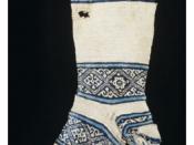12th-century cotton sock, found in Egypt. The knitter of this sock started work at the toe and then worked up towards the leg. The heel was made last and then attached to loops formed while knitting the leg. This practice allowed the heel to be easily rep