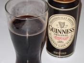 Can of Guinness Original, plus the beer in a glass