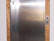 The entrance to a typical style elevator found in many residential and smaller commercial buildings throughout North America. This elevator is located in Winter Park, CO. This elevator is made by Dover Elevator. Dover Elevator sold its division to Thyssen