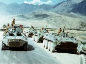 Soviet troops (in right row) withdrawing from Afghanistan in 1988. Afghan government BTR on the left.