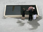 Fifth anniversary Commemoration of the terrorist attacks on September 11, 2001 : President George W. Bush and Laura Bush lay a wreath in the south tower reflecting pool at the World Trade Center site in New York, September 10, 2006.