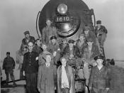 ES210-13-16 Dr. Syngman Rhee, President, ROK, and Mrs. Rhee (foreground) with Non-commissioned officers of the 62nd Engineets and train crew members in front of the first locomotive to cross the newly construdted railroad bridge spanning the Han River at 