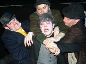 From Victoria College's production of Waiting For Godot. Lucky the slave gets tackled at the end of his famous monologue.