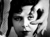 Simone Mareuil's eye being held open by Luis Buñuel in the opening scene.