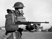 English: THE BRITISH ARMY IN THE UNITED KINGDOM 1939-45. A lance-corporal of the East Surrey Regiment poses with a 'Tommy gun', Chatham in Kent.