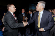 English: SAN DIEGO (Jan. 25, 2011) Department of the Navy Chief Information Officer Terry A. Halvorson, left, congratulates Dr. William Leubke, technical director for Naval Surface Warfare Center (NSWC), Corona Division, after presenting the Department of