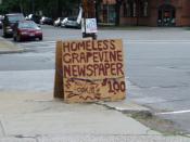 A sign advertising the Homeless Grapevine, a street newspaper, at Lincoln Park, Tremont, Ohio, U.S.A.