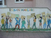 English: A mural describing human rights in Turkey outside of the public education building in Bayramic Turkey