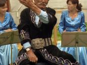 A traditional Kyrgyz manaschi performing part of the epic poem at a yurt camp in Karakol