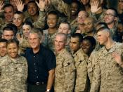 U.S. Service members gather around President George W. Bush during a visit to Al Asad Air Base, Iraq. Bush was joined by Secretary of Defense Robert M. Gates, Secretary of State Condolezza Rice, Chairman of the Joint Chiefs of Staff Gen. Peter Pace, U.S. 
