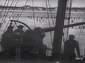 English: Royal Navy gunner covering the troops retreat at Dunkirk (France, 1940). Screenhot taken from the 1943 United States Army propaganda film Divide and Conquer (Why We Fight #3) directed by Frank Capra and partially based on, news archives, animatio