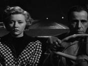 English: Description: Low-resolution reproduction of screenshot from trailer for the movie In a Lonely Place (1950), featuring stars Gloria Grahame and Humphrey Bogart