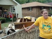 English: Smithers, WV, July 9, 2001 -- Constance Amos, of Craigsville, takes a break from cleaning up, after yesterday's floods brought mud into her 83-year-old mother's home in Smithers. Photo by Amanda Bicknell/ FEMA News Photo
