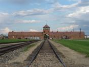 English: The main gate at the former Nazi death camp of Birkenau. Note that this is inside the camp looking back from the loading ramp to the 