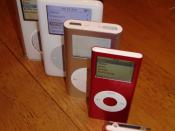A stack of the iPods I now own... included are the 1Gb iPod shuffle (2nd Gen), iPod nano Product(RED) 4Gb (2nd Gen), iPod mini 4Gb, iPod 20Gb (4th Gen), and iPod video 80Gb (5.5 Gen).
