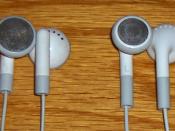 Two designs of iPod earphones. The current version is shown on the right.