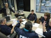English: Atlanta, GA, March 24, 2008 -- Federal Emergency Management Agency (FEMA) Community Relations Team (CR) members meet at FEMA's Regional Office. FEMA CR teams will go from house to house in damaged areas to help in distributing information on 