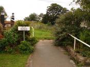 English: Trust There are no physical barriers apart from a stile leading to the public footpath which runs through the North Sea Camp Open Prison and alongside the fence to the left. The prisoners' quarters are to the right. You may even get a chance to s