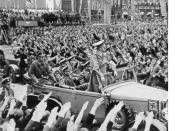 Hitler (standing in Mercedes) drives through the crowd in Cheb (German: Eger ) in October 1938, part of the German populated Sudetenland region of Czechoslovakia, which was annexed to Nazi Germany due to the Munich Agreement