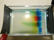 Gel electrophoresis, in this case used to separate different dyes. This techniques is used in DNA profiling.