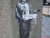 A stencil of Charles Manson in a prison suit, hitchhiking to anywhere, Archway, London