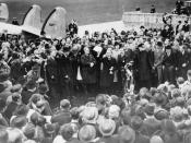 Neville Chamberlain showing the Anglo-German Declaration to a crowd at Heston Aerodrome on 30 September 1938.