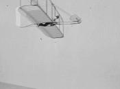 Wilbur Wright piloting 1902 glider near Kitty Hawk, N.C.