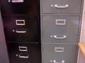 Two tall metal file cabinets for work or home use